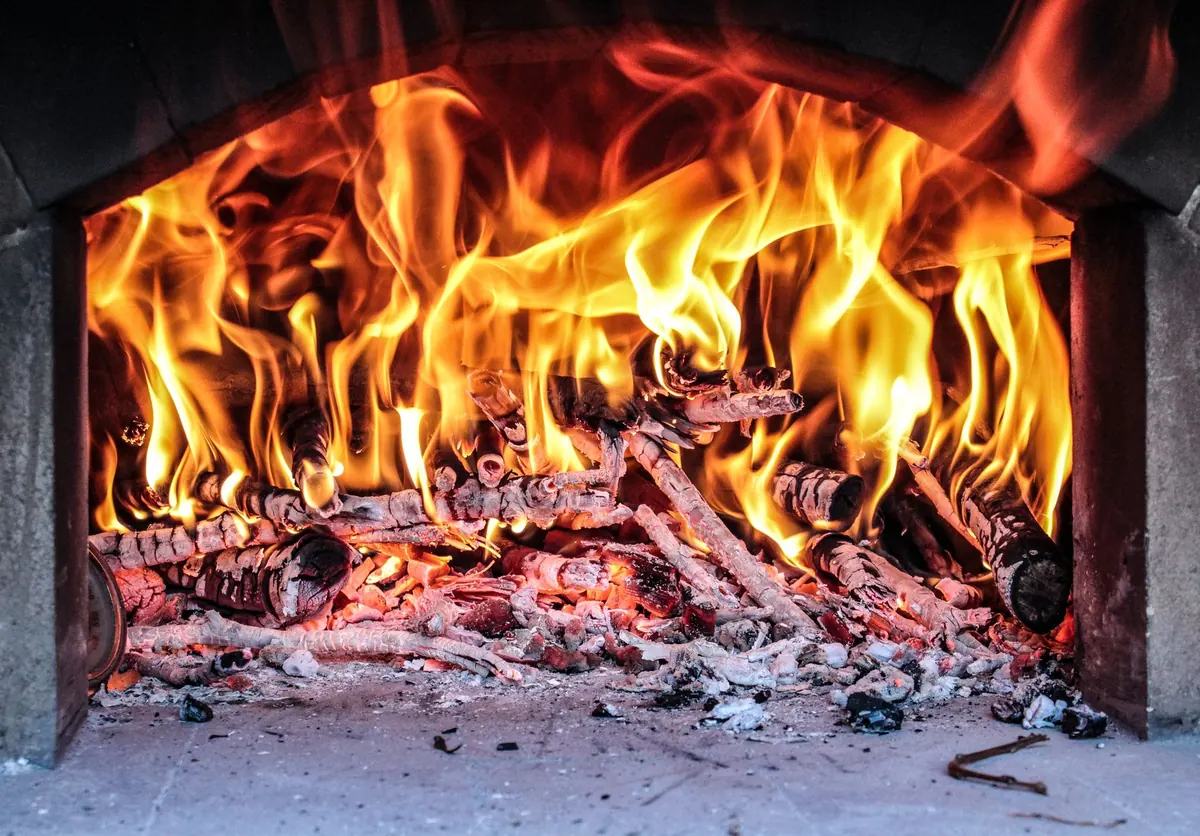 How to Light a Wood-Burning Stove Without Smoking Out the Room